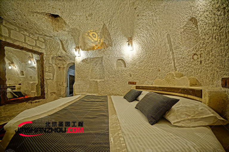 仿照自然山洞外形設計的的臥室仿真窯洞客棧
